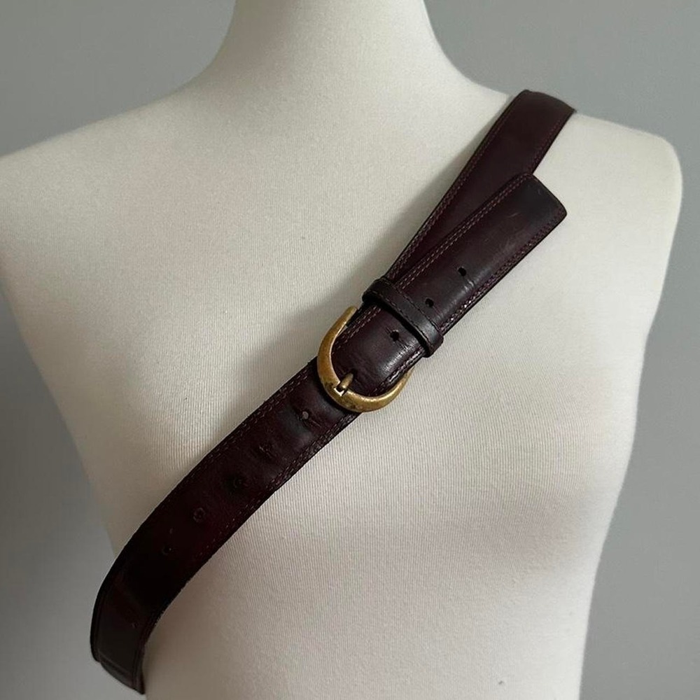 Vintage leather belt with an oval, solid brass buckle